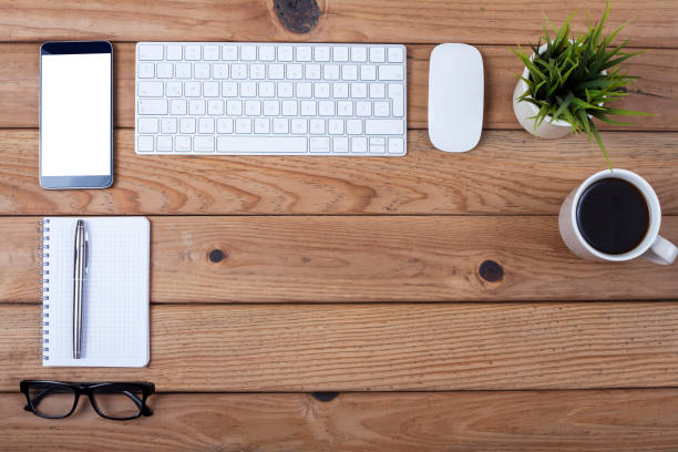 istock keyboard and electronic devices over office desk 1187436100