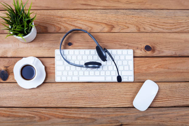 istock keyboard and electronic devices over office desk 1187437259