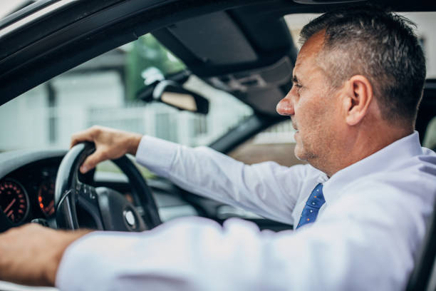 istock Elderly businessman in a car 1187442730