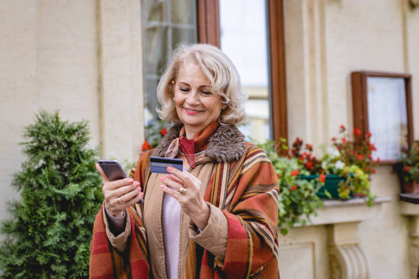 istock Happy online senior shopper 1187442881