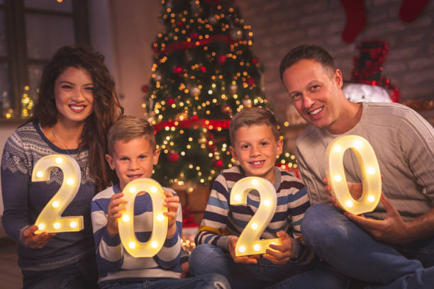 istock Family holding illuminative numbers 2020 1187444546