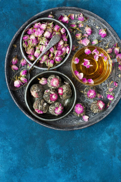 istock Composition with tea mug and rose buds on tray 1187447932