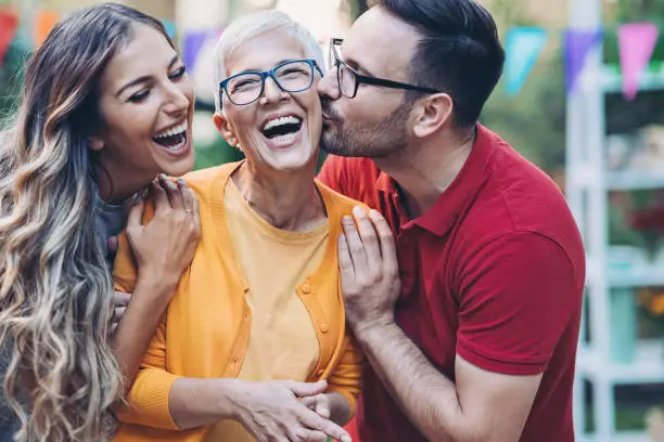 Photo of Happy mother-in-law with young family