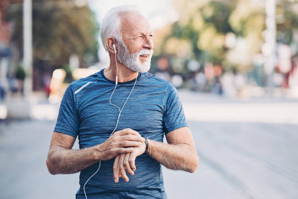istock Senior sportsman checking his smart watch 1187451189
