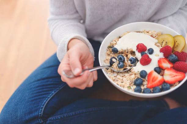 istock Woman Eating healthy breakfast bowl. 1187452087