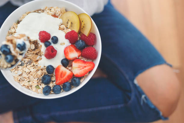 istock Woman Eating healthy breakfast bowl. 1187452095