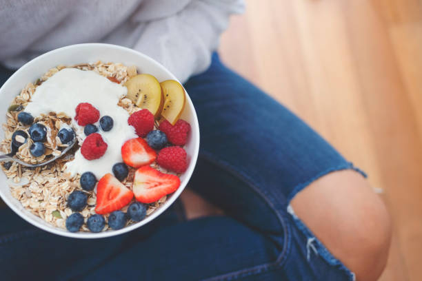 istock Woman Eating healthy breakfast bowl. 1187452104