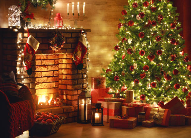 istock interior christmas. magic glowing tree, fireplace, gifts in  dark 1187452565
