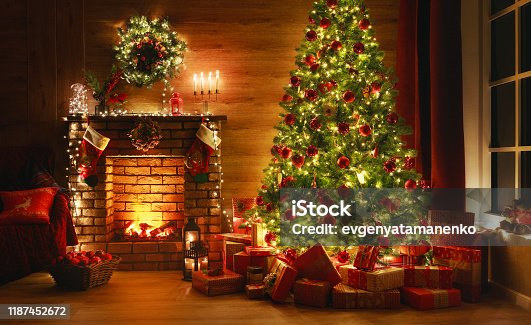 istock interior christmas. magic glowing tree, fireplace, gifts in  dark 1187452672