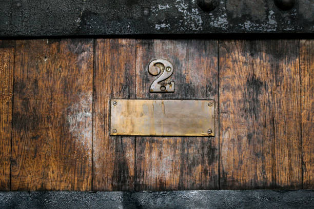 brass signage on wooden floor bronze