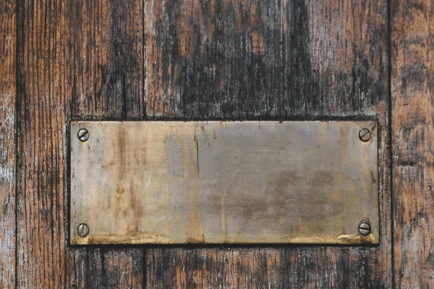 istock brass signage on wooden floor bronze 1187460201