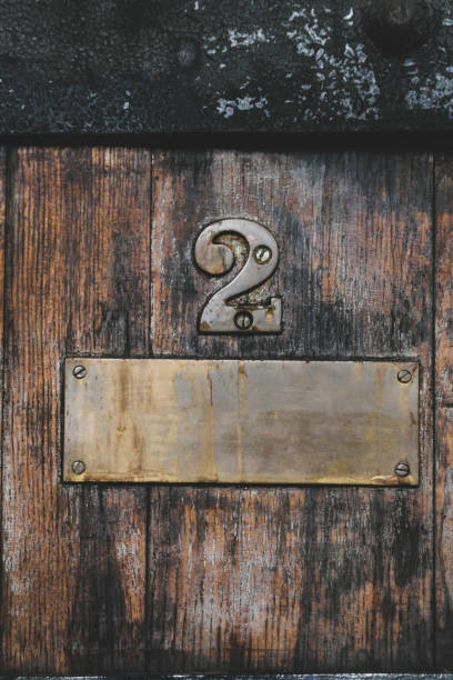 istock brass signage on wooden floor bronze 1187460339