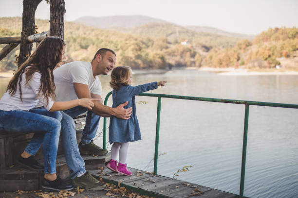 istock Happy family in nature park 1187460376