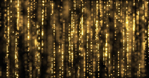 istock Golden glitter rain, gold particles sparkling threads curtain. Bokeh light sparks and shimmer glow on luxury black and gold background 1187463656