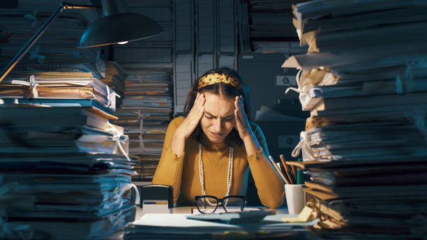 istock Exhausted businesswoman in her office 1187468563