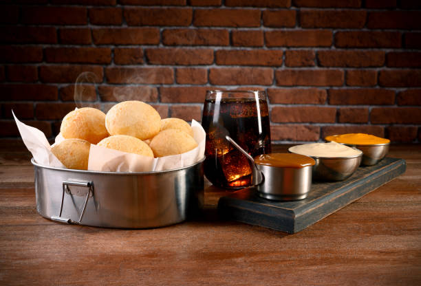 Portion of Cheese Bread - Traditional Brazilian food with cheddar, curd and dulce de leche stock photo
