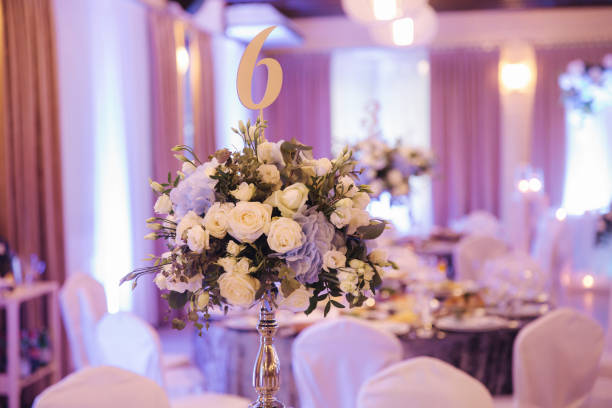 istock Wedding bouquet in restaurant on the table. Blue and white flowers. Rose and hydrangea 1187469024