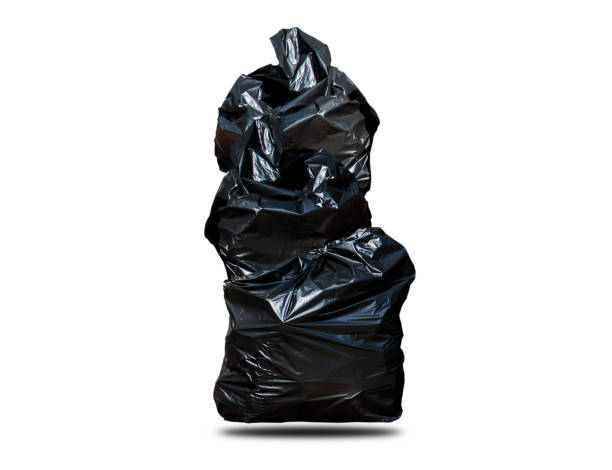 istock Black garbage bags separated from the white background, 3 pieces. Shiny. Keeping clean. 1187474954