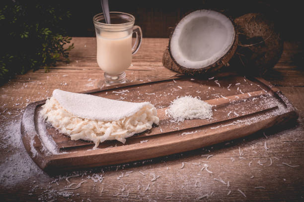 Coconut tapioca with condensed milk | Cassava flour pan, condensed milk and coconut - Typical northeastern Brazilian food stock photo