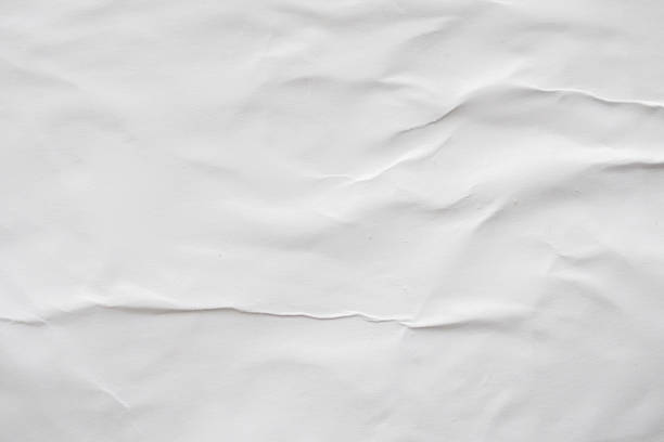 istock Blank white crumpled and creased paper poster texture background 1187482302