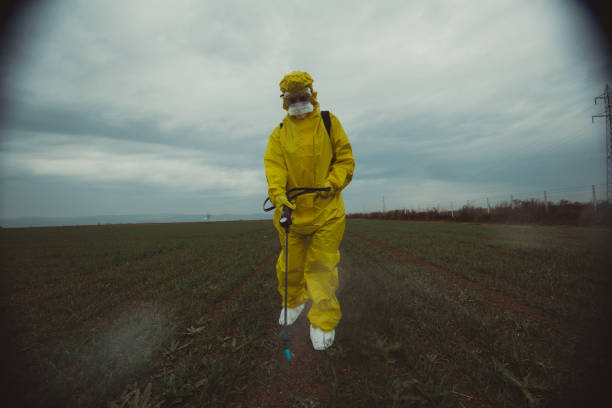 istock Worker spraying toxic pesticides 1187482747