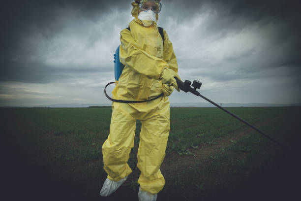 istock Worker spraying toxic pesticides 1187482750