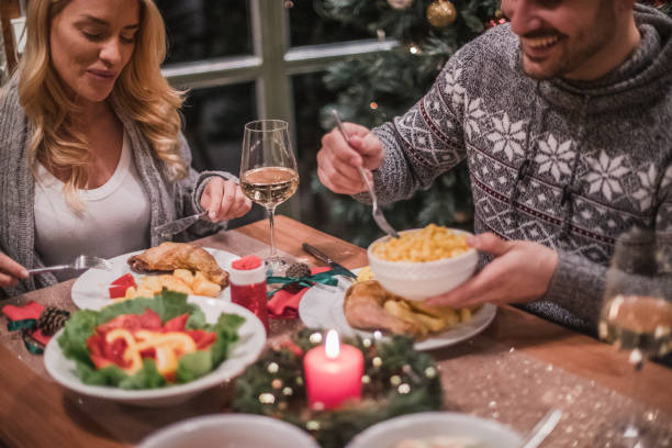 istock A handsome young couple having a candlelit dinner on Christmas eve. 1187482887