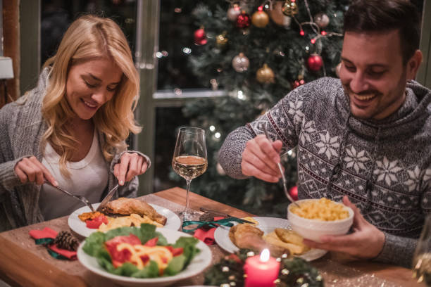 istock A handsome young couple having a candlelit dinner on Christmas eve. 1187482891