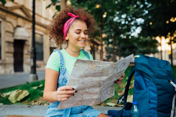 istock Young tourist woman with the map 1187483058