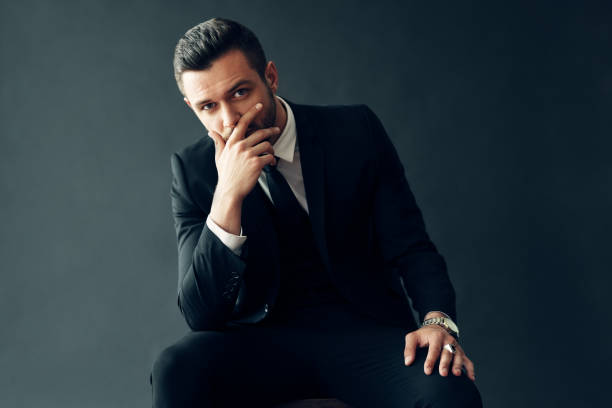 istock Elegant young man portrait on black background 1187485712