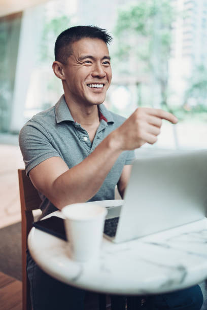istock Cheerful Asian ethnicity man in a restaurant 1187486920