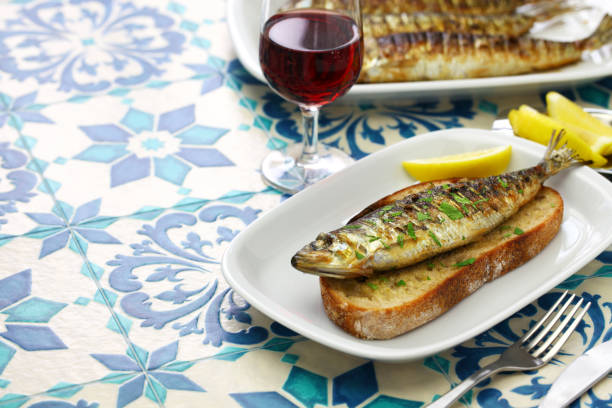 portuguese grilled sardine on toasted bread sardinhas assadas, portuguese grilled sardine on toasted bread traditionally portuguese stock pictures, royalty-free photos & images