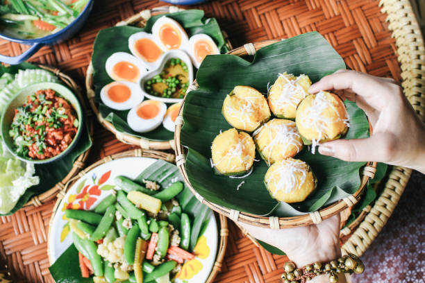 istock Toddy Palm cake (Kanom Tarn) Thai dessert and packaging from banana leaf with freshly grated coconut A local popular Thai dessert made from coconut milk, rice flour, yeast and toddy palms. 1187497265