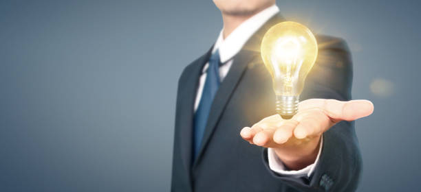 istock Hand of holding illuminated light bulb,innovation inspiration concept 1187501698