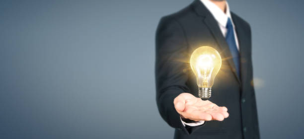 istock Hand of holding illuminated light bulb,innovation inspiration concept 1187501699