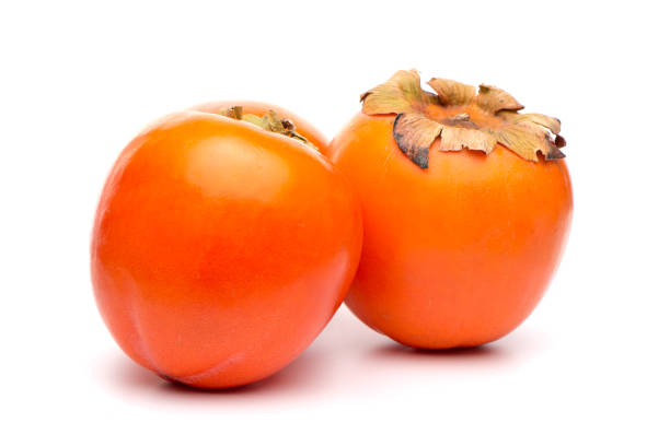 istock Persimmon fruits on white 1187503187