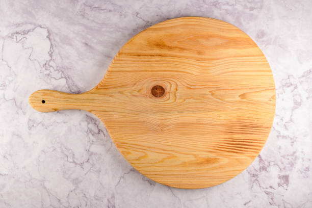 istock Wooden cutting board on a gray marble background 1187504521
