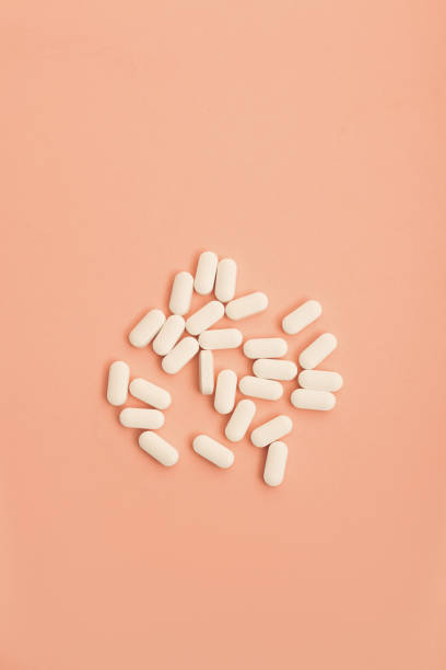 istock Medicine on coral/pink back ground 1187505344