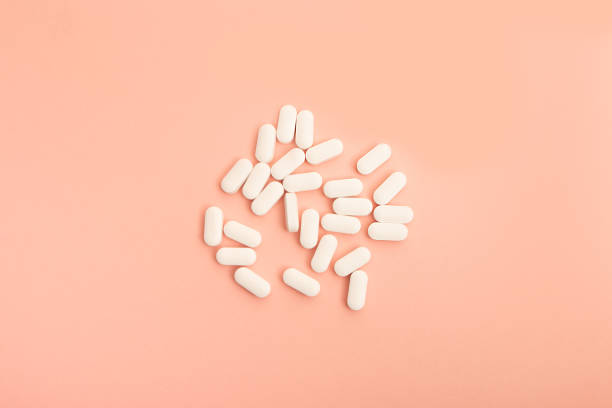 istock Medicine on coral/pink back ground 1187505549