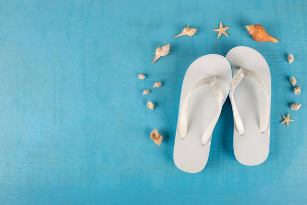 istock Summer beach sea accessories. flip flops, shells, starfish on blue background top view flat lay copy space. Summer background Holiday vacation travel concept 1187509563