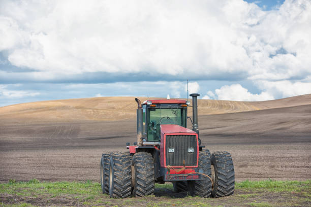 Heavy modern tractor isolated on white background with a drop shadow.