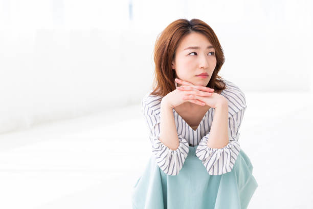 istock asian woman who thinks 1187518581