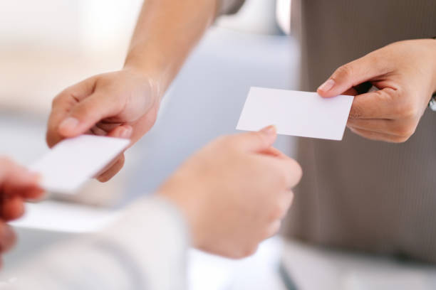 istock businessman holding and exchanging empty business card 1187520482