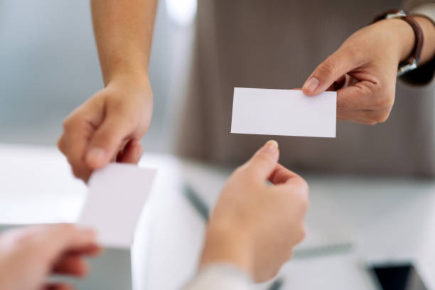 istock businessman holding and exchanging empty business card 1187520488