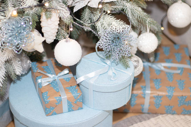 istock Christmas gift is under the tree. New year and Christmas. Gift. Magic. Packaged gift. Beautiful package. Bow on the package. 1187534483