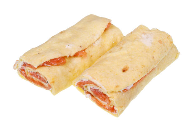 Handmade lavash rolls with smoked salmon and soft cheese. Isolated on white studio macro