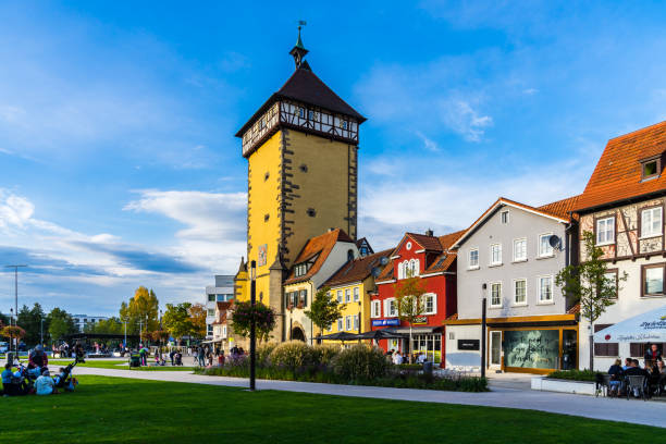 Beautiful colorful ancient houses next to old city gate called tuebinger tor, a popular meeting place for people stock photo