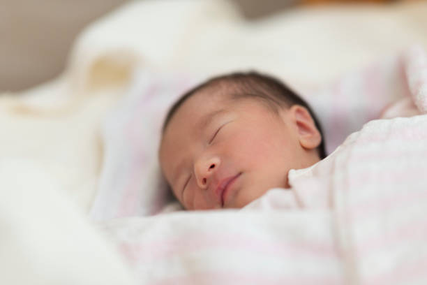 istock Baby sleeping in newborn room 1187551793