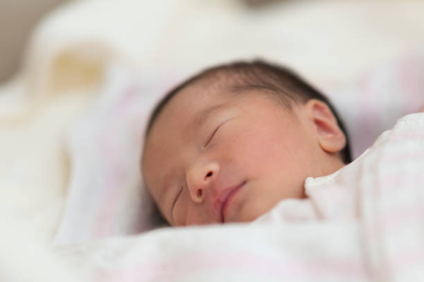 istock Baby sleeping in newborn room 1187551870