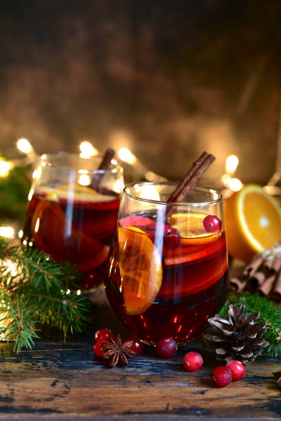 istock Red spicy christmas mulled wine with cranberries, apple and orange 1187553370